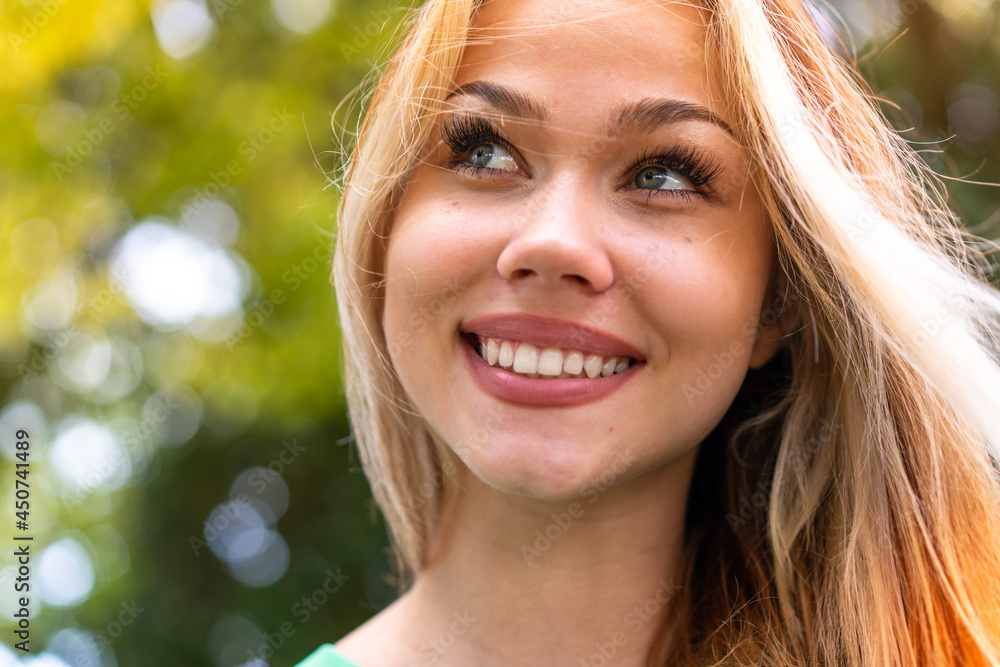 Young student woman at outdoors with happy expression Young student woman at outdoors with happy expression