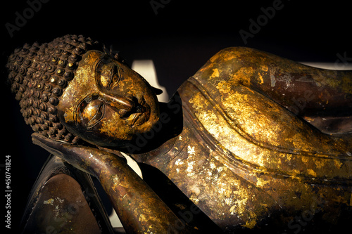 Fototapeta Ancient golden reclining buddha at the buddha temple,thailand