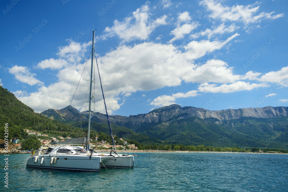 Majestic view at sailing catamaran boating in sea. Majestic view at sailing catamaran boating in sea.