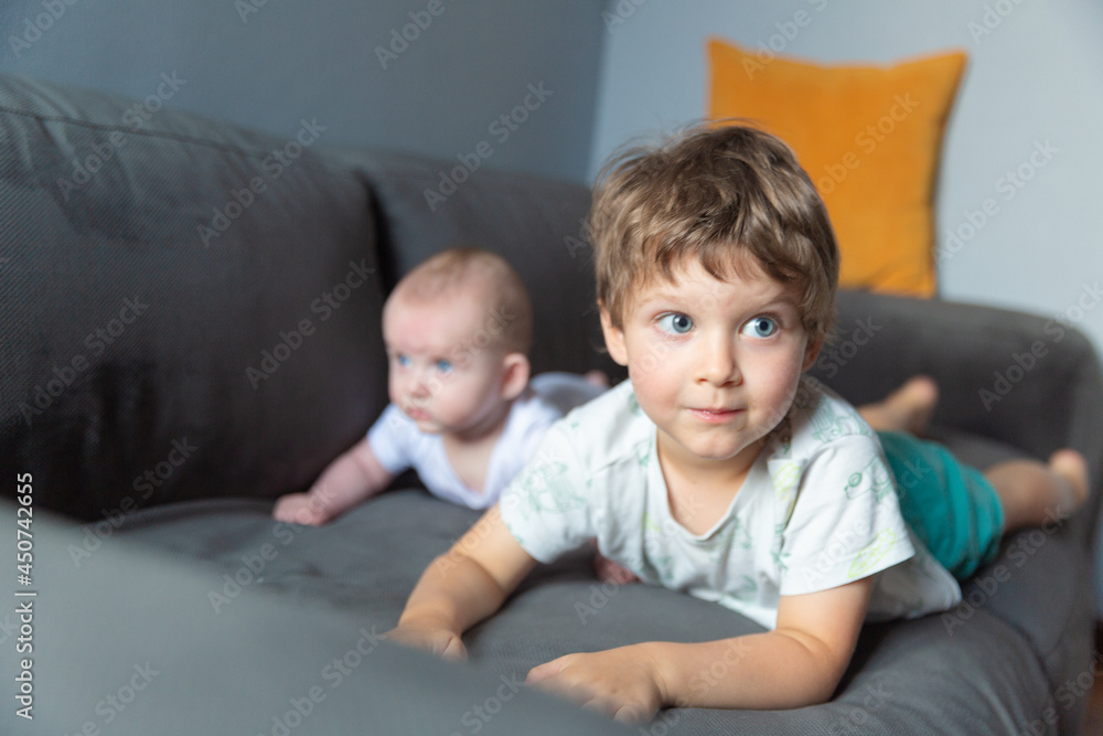 Two boys lying on the sofa Two boys lying on the sofa