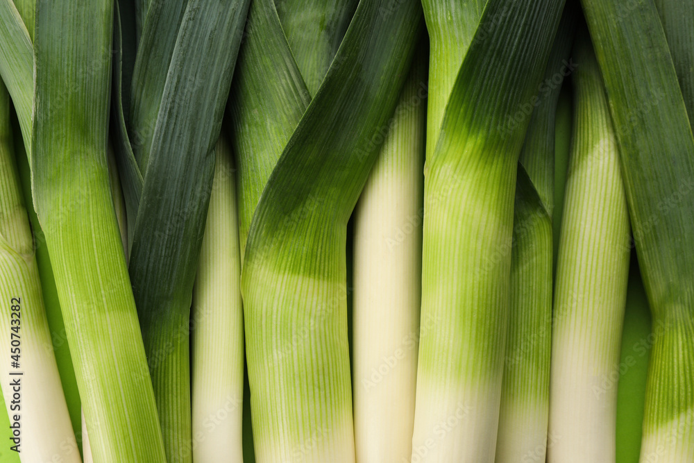 Fresh raw leeks as background, top view Fresh raw leeks as background, top view