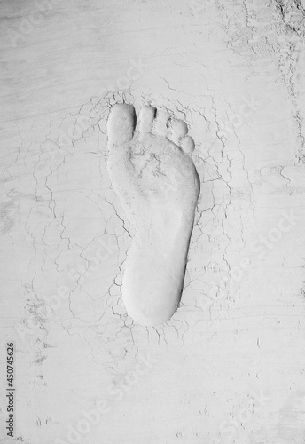 Human footprint in cement. Labor day and hard work idea. Minimal abstract civilization progress concept. Copy space.