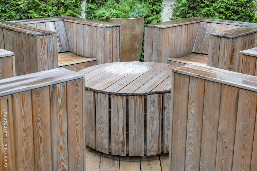 Handmade furniture made of wooden boards. Idea for landscaping the garden and backyard Handmade furniture made of wooden boards. Idea for landscaping the garden and backyard