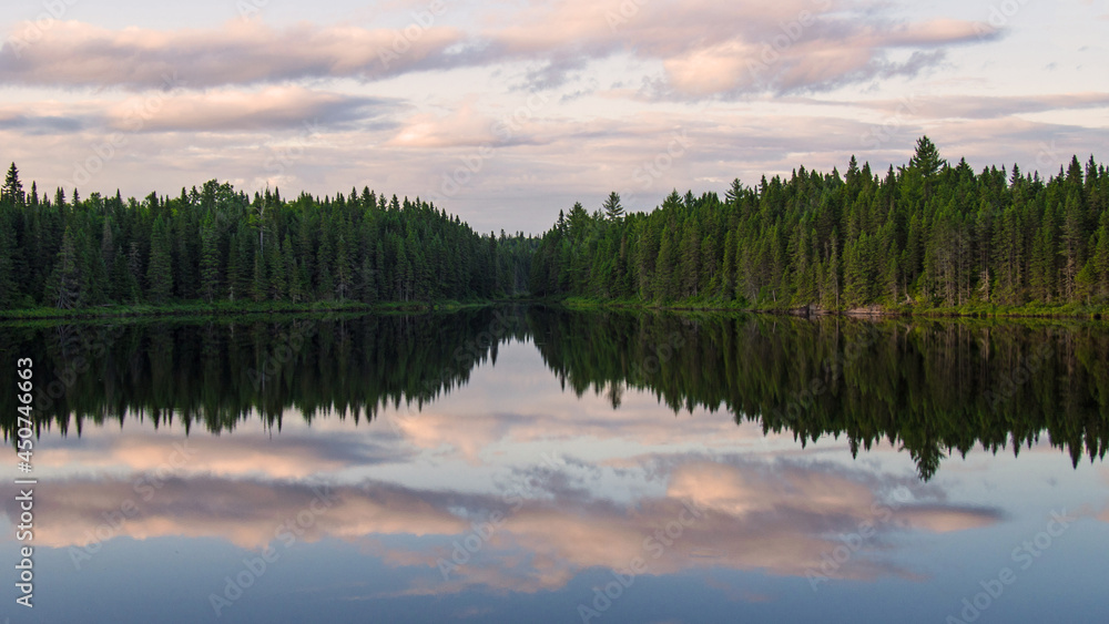 Beautiful deep wood lake at sunset, Quebec, Canada