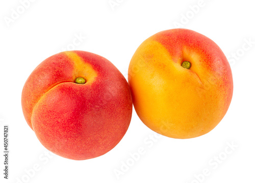 Two whole apricots isolated on a white background.