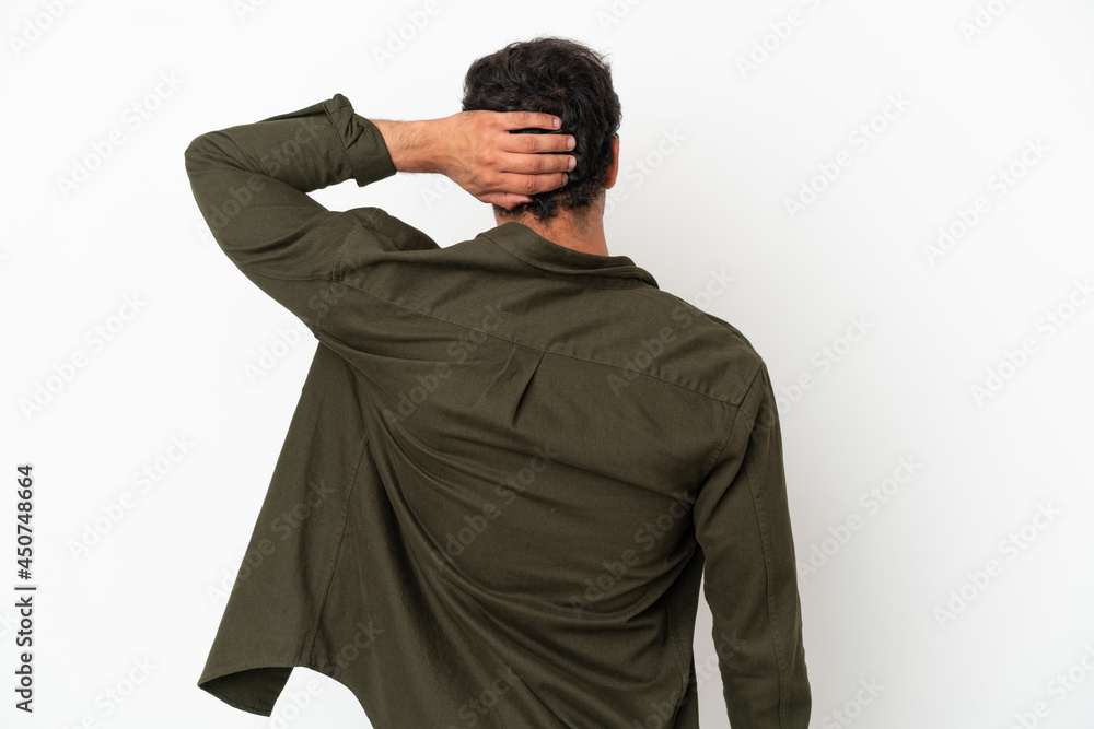 Caucasian handsome man over isolated white background in back position and thinking Caucasian handsome man over isolated white background in back position and thinking