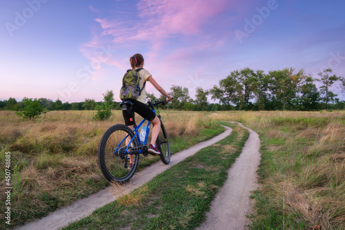 Woman is riding a mountain ...