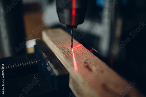 Drilling machine with laser sight in the workshop