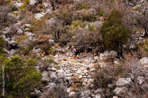 Female Hiker Climbing Uphill In Guadalupe Mountains