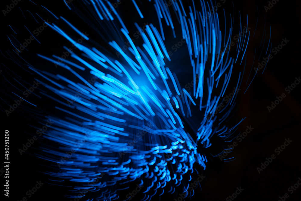 Fototapeta premium Blue abstract particles and lines with bokeh and blur in dark background.