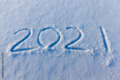the inscription about the new year 2022 on the snow in winter © rsooll