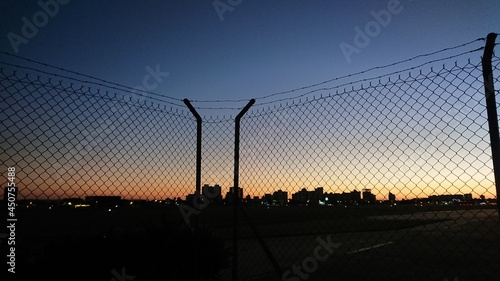 sunset in the city - fence © Fabricio