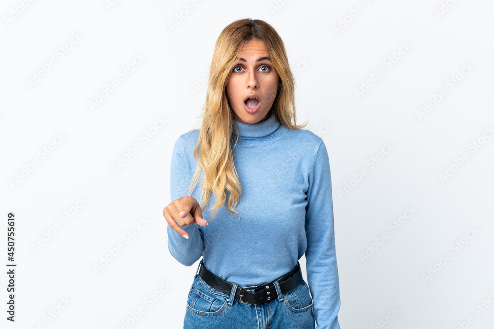 Young blonde Uruguayan woman over isolated background surprised and pointing front Young blonde Uruguayan woman over isolated background surprised and pointing front