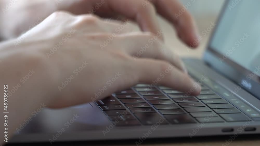 young man typing on laptop young man typing on laptop