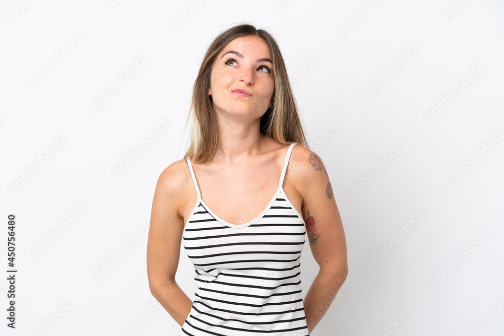 Young Romanian woman isolated on white background and looking up Young Romanian woman isolated on white background and looking up