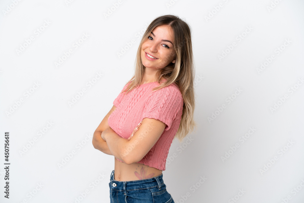 Young Romanian woman isolated on white background with arms crossed and looking forward Young Romanian woman isolated on white background with arms crossed and looking forward