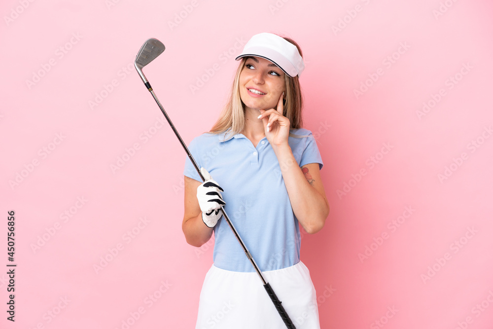 Young golfer player woman isolated on pink background thinking an idea while looking up Young golfer player woman isolated on pink background thinking an idea while looking up