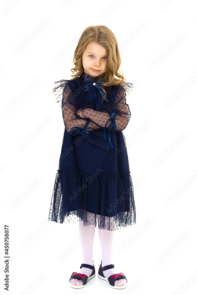 Cute little serious girl posing with arms crossed Cute little serious girl posing with arms crossed