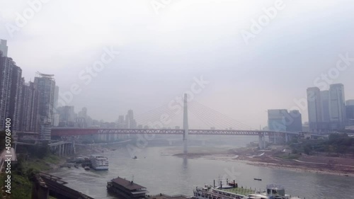 Low water level on Yangtze river in Chongqing. Crossing with Jialing river during drought conditions. Dry riverbeds in major Chinese city. photo