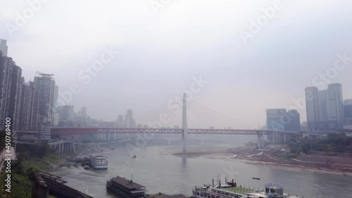 Low water level on Yangtze river in Chongqing. Crossing with Jialing river during drought conditions. Dry riverbeds in major Chinese city.