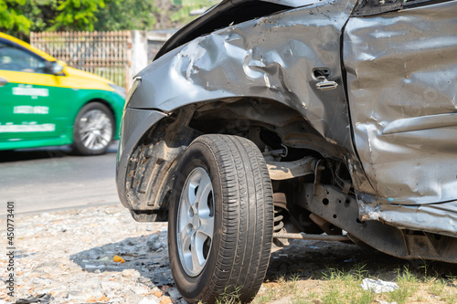  Silver car get damaged by accident on the road. concept of road safety.