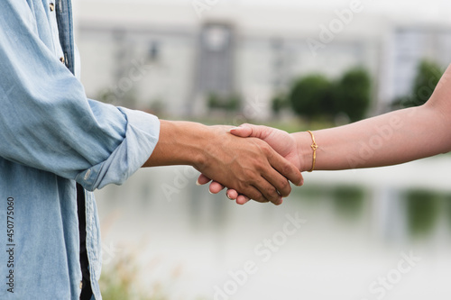 Friends shake hand union friendship community © Suriyo