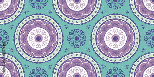 Seamless vector pattern of a brightly colored mandala. Great for teens, tweens, young women's fashion and fun.