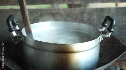 Pot on the fire. cooking in the field at a campfire in a hike in the forest. a hot flame of an open fire.