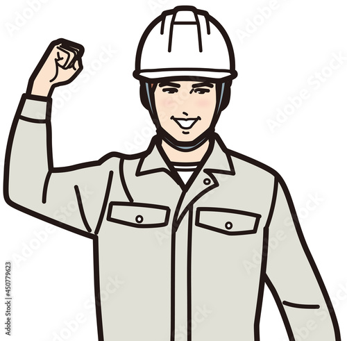 ガッツポーズするヘルメットの男性