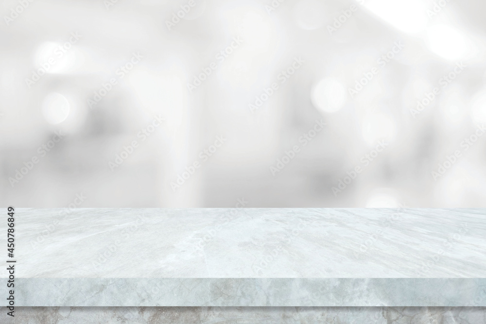 Empty white table top, counter, desk over blur perspective store with