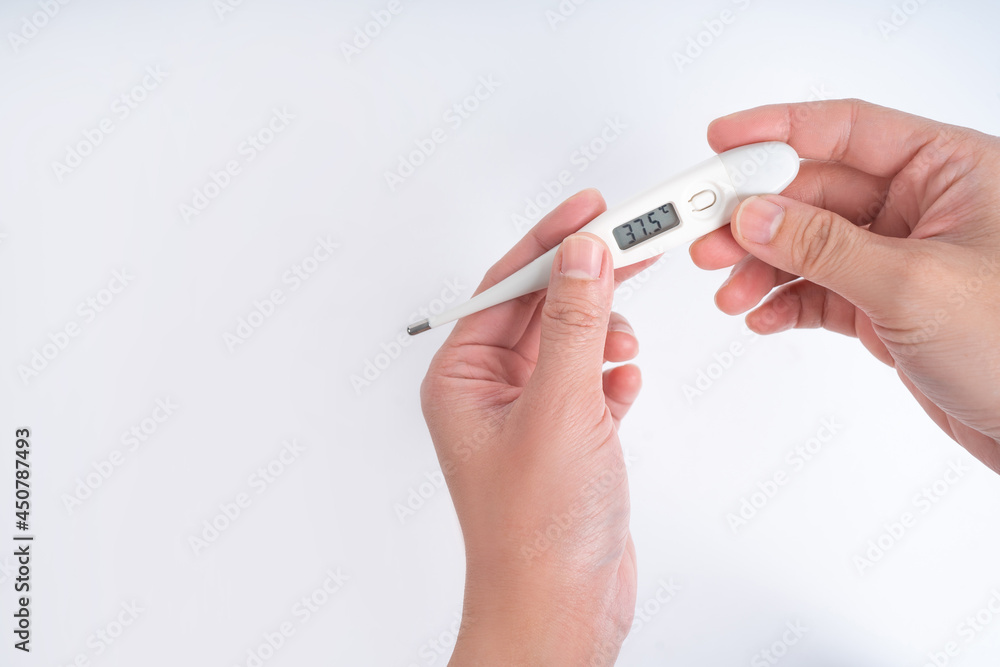 Holding a thermometer on a white background, isolated background. Holding a thermometer on a white background, isolated background.