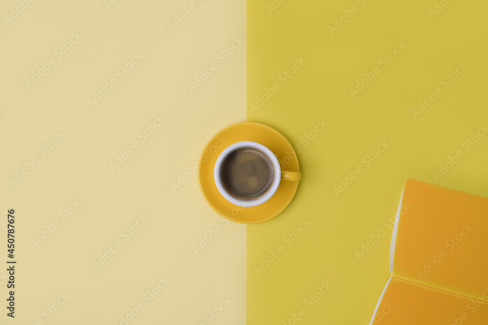 Above view a cup of coffee and notebook on yellow background. Above view a cup of coffee and notebook on yellow background.