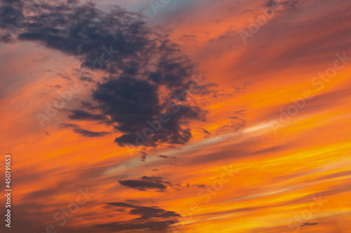 Fototapeta Naklejka Na Ścianę i Meble -  Bright orange sky at sunset with dark clouds