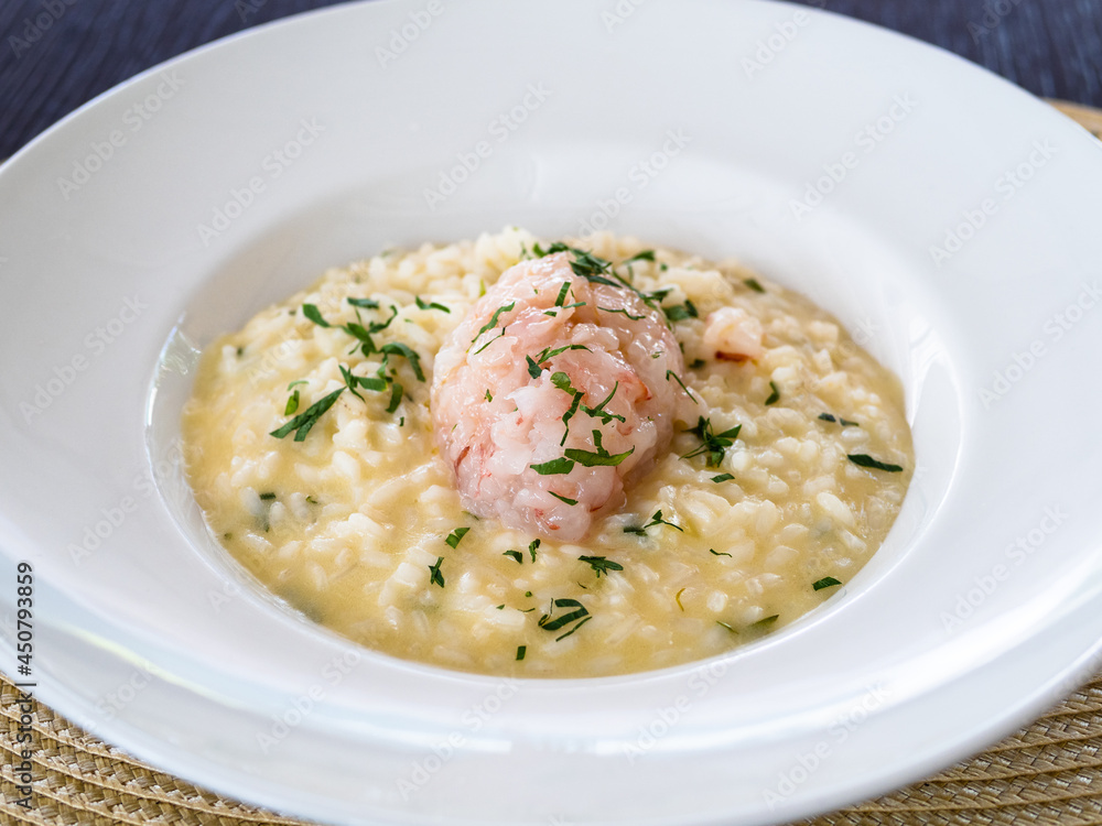 portion of risotto with shrimp tartare in plate