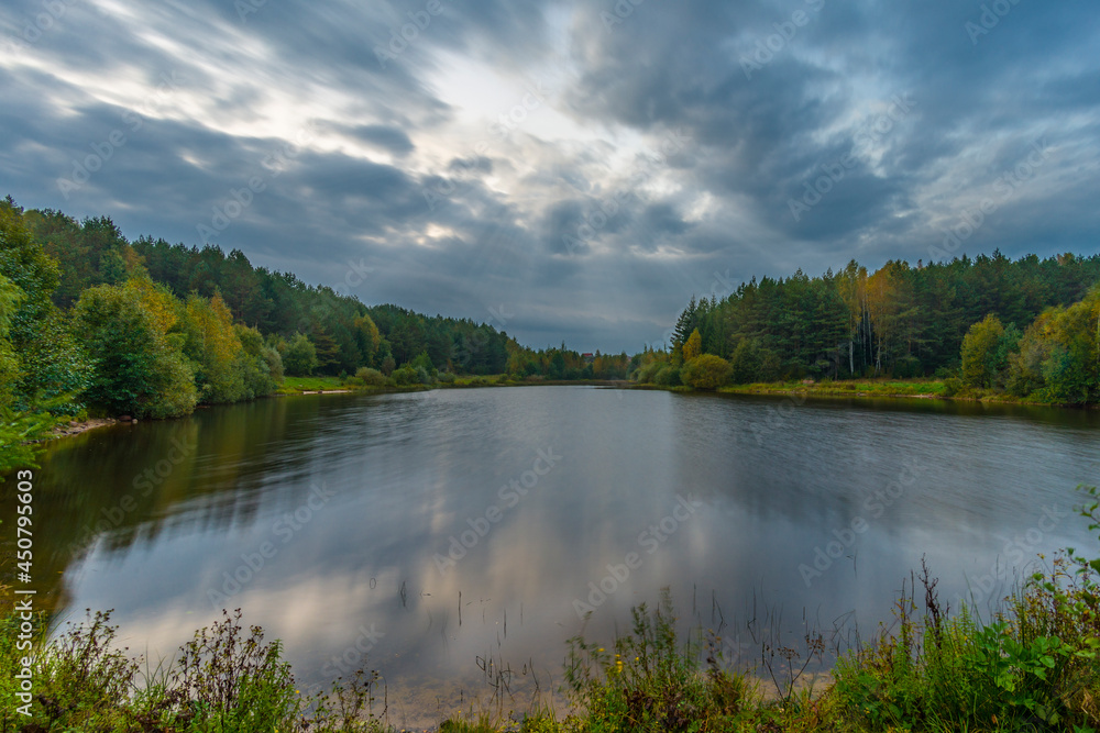 A small forest lake at autumn time, Belarus