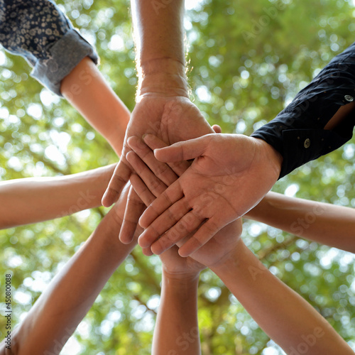 group of businessman people holding hands together. Diversity freedom people join unity relationship. Teamwork worker hands touch outdoor.