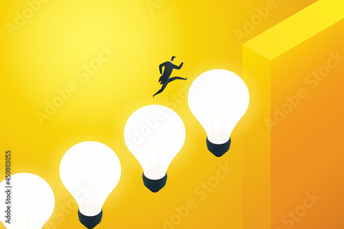 Businessman running on a light bulb up the cliff.