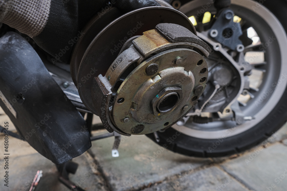 Motorcycle CVT transmission gear fixing enngine close up Motorcycle CVT transmission gear fixing enngine close up