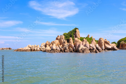 The rocky beach on the island has Ke Ga lighthouse in Binh Thuan, Vietnam