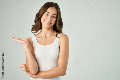 cheerful brunette gesturing with her hands smile attractive look Studio