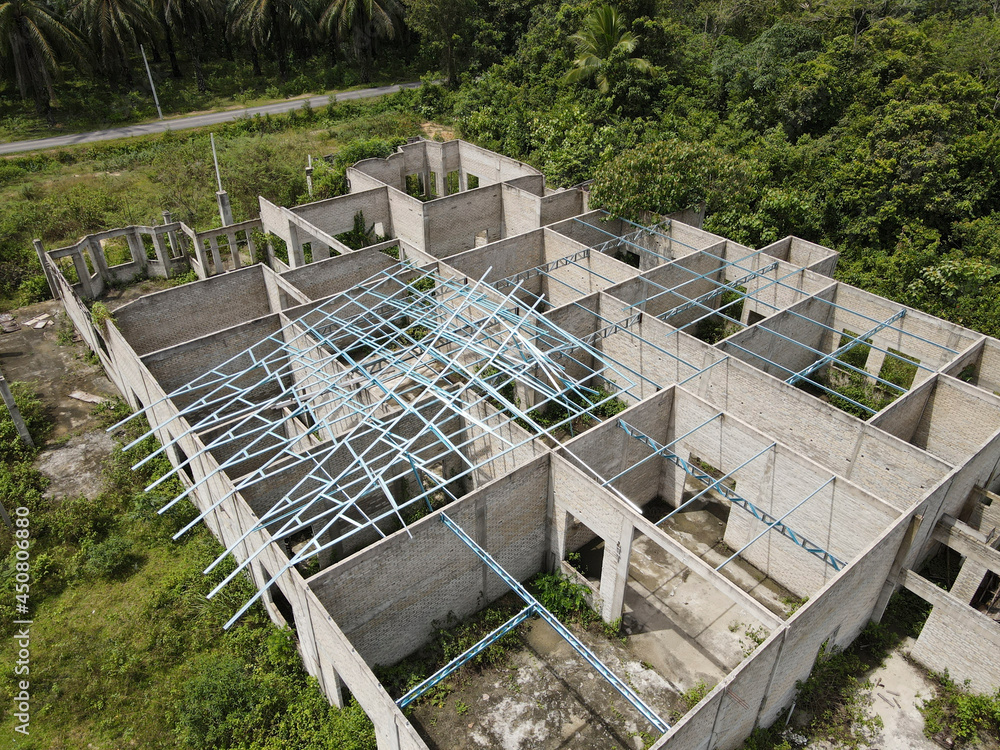 Aerial view of an abandoned house during construction. Selective focus points. Blurred background Aerial view of an abandoned house during construction. Selective focus points. Blurred background