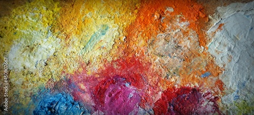 Oil, yellow, green, white, orange mixed together on a palette with drawing