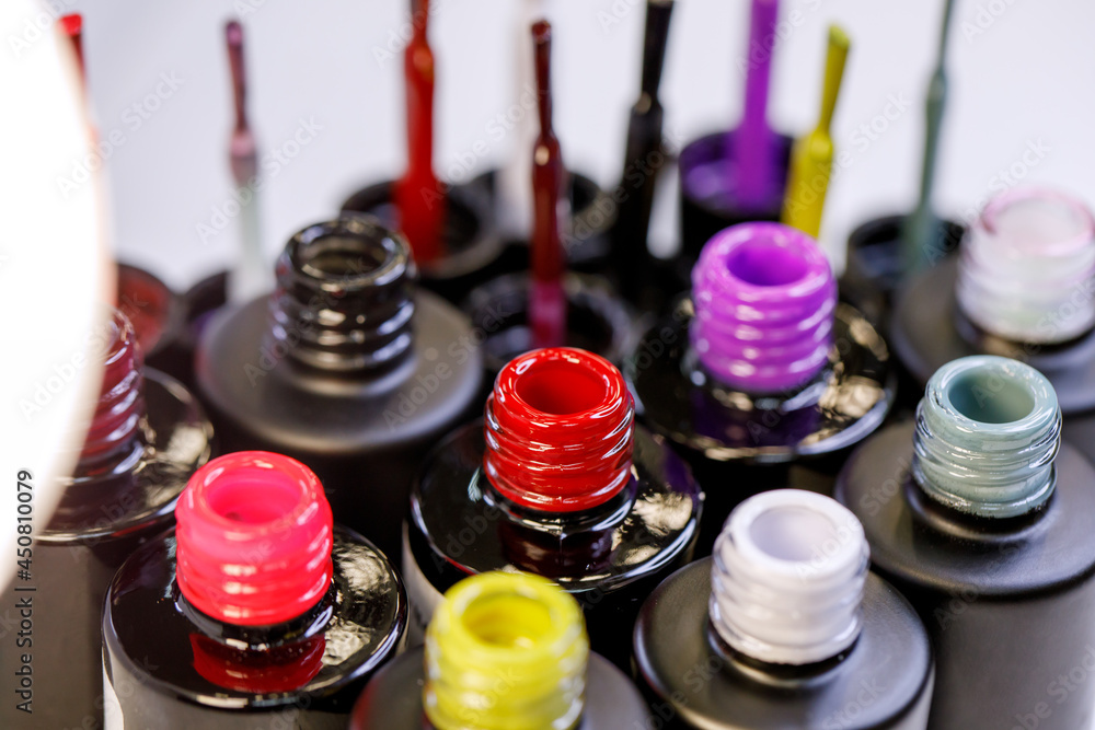 Multicolored gel varnishes for manicure and pedicure closeup