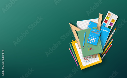 Vector illustration with school supplies.A school textbook, notebooks and other stationery on the background of a school green board.A template for a banner or congratulations on the beginning of the 