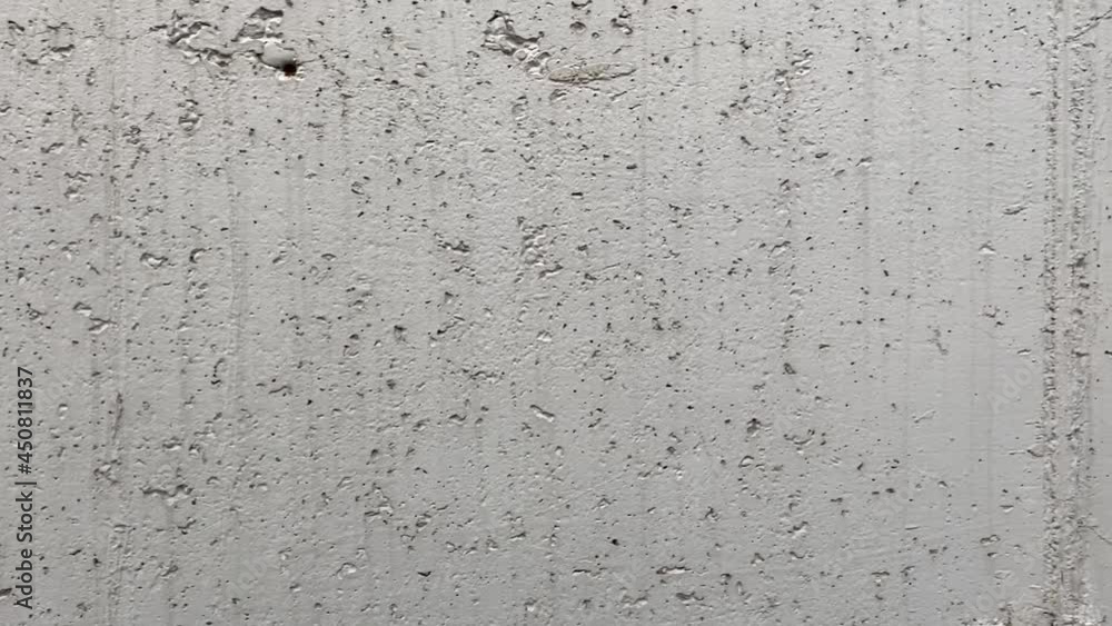 Painted concrete wall with plenty of cracks, holes and other defects. View close-up Painted concrete wall with plenty of cracks, holes and other defects. View close-up