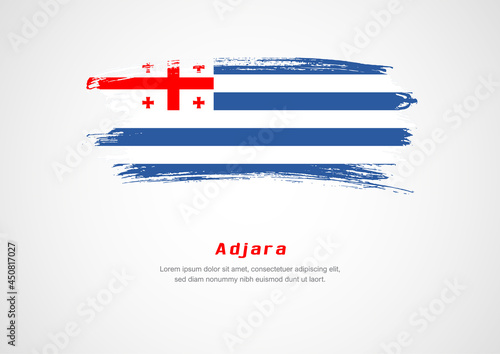 Happy National Day of Adjara. Abstract country flag on hand drawn brush stroke vector patriotic background