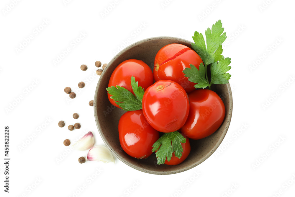 Bowl with pickled tomatoes and spices isolated on white background Bowl with pickled tomatoes and spices isolated on white background