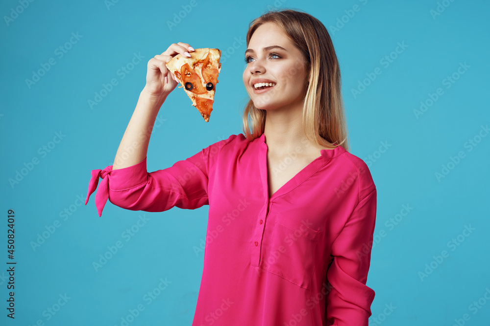 woman in a pink shirt with pizza in her hands junk food close-up woman in a pink shirt with pizza in her hands junk food close-up