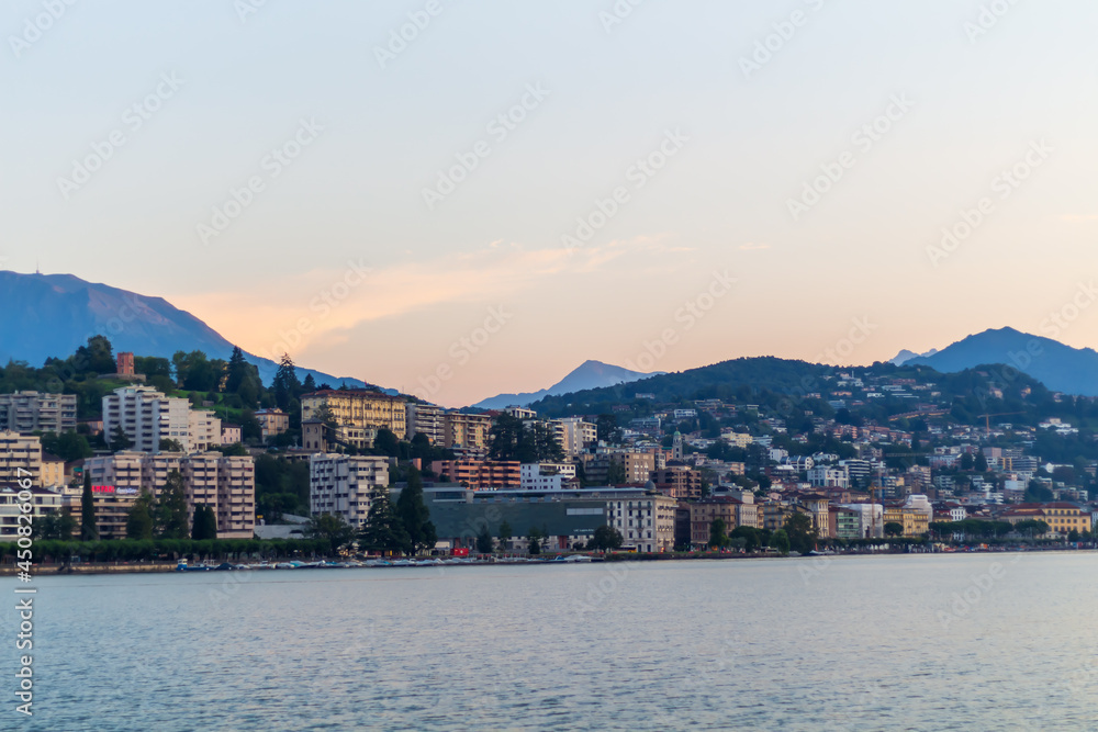  Lake promenade City of Lugano with sunrise sky, Travel in Switzerland