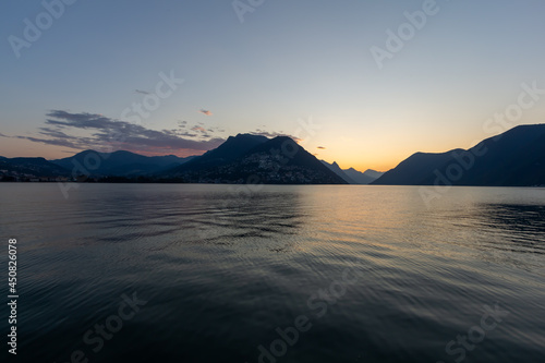 Panoramic view at sunrise time with hills on the lake Lugano  Paradiso  Switzerland